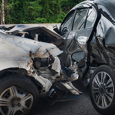 Two cars involved in an accident displaying visible damage - Brian Moore Injury Law