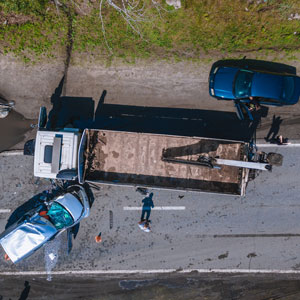 Overhead image depicting a truck and a car on the roadside - Brian Moore Injury Law